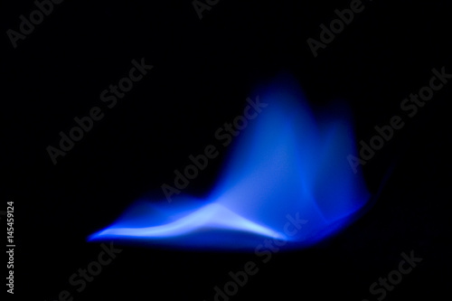 Typical blue flame when burning sulfur photo