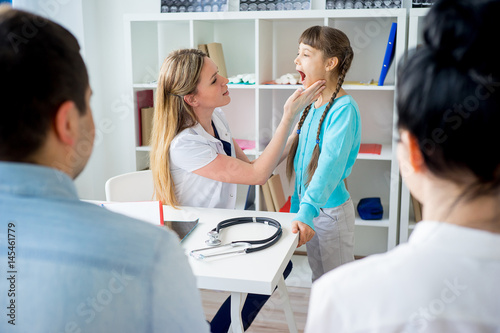 Doctor examining a kid