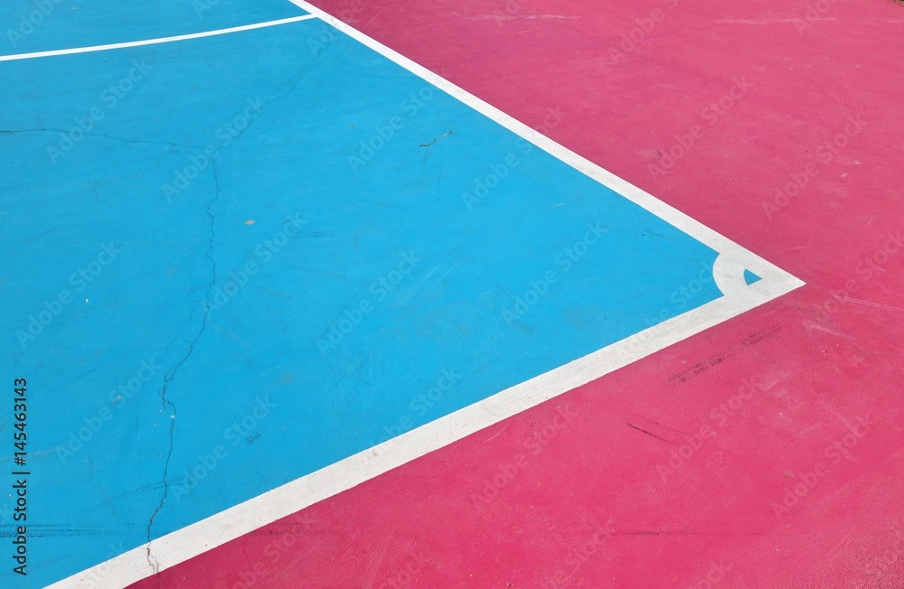 Fototapeta premium White line on colorful concrete floor of outdoor basketball court.