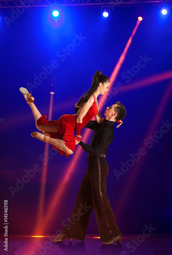 Couple ballroom dancing on illumination