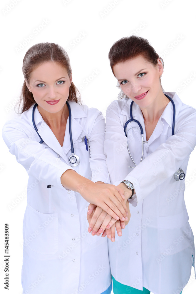 Doctors and nurses stacking hands. Isolated on white background Doctors and nurses stacking hands. Isolated on white background
