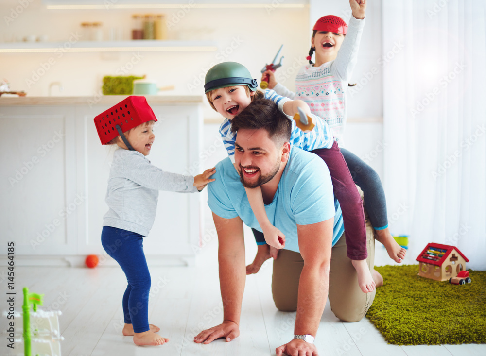 happy family playing together at home, riding on father Stock Photo