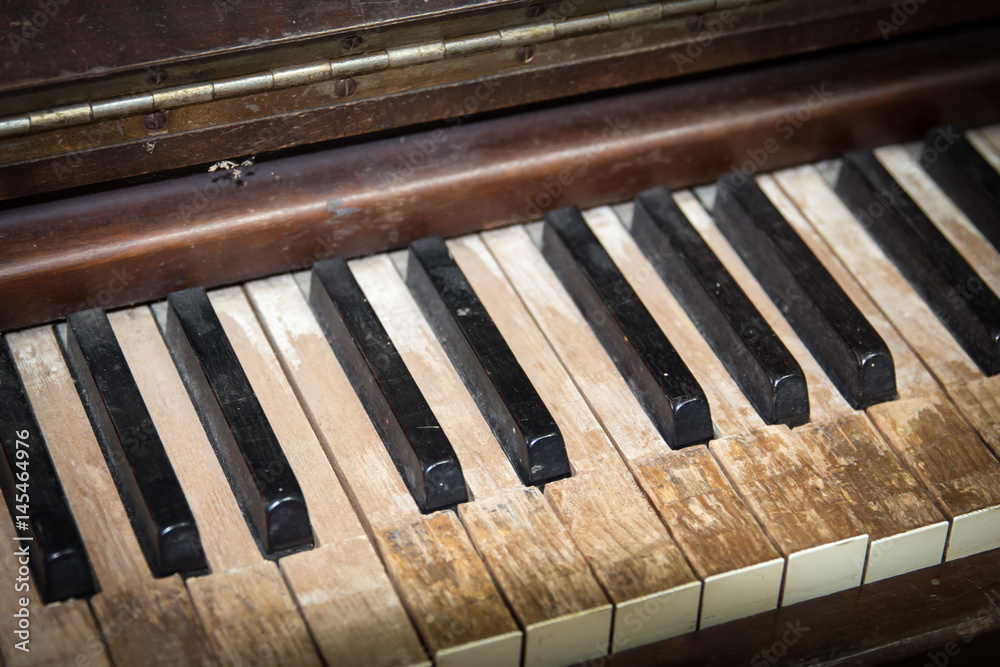 horizontal close up image of very old antique vintage piano keys. horizontal close up image of very old antique vintage piano keys.