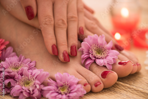 female feet and hands at spa salon