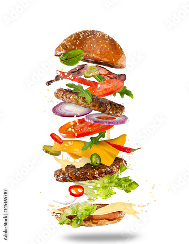 Big tasty burger with flyin...