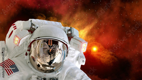 Astronaut sun planet spaceman helmet stars space suit galaxy universe. Elements of this image furnished by NASA.