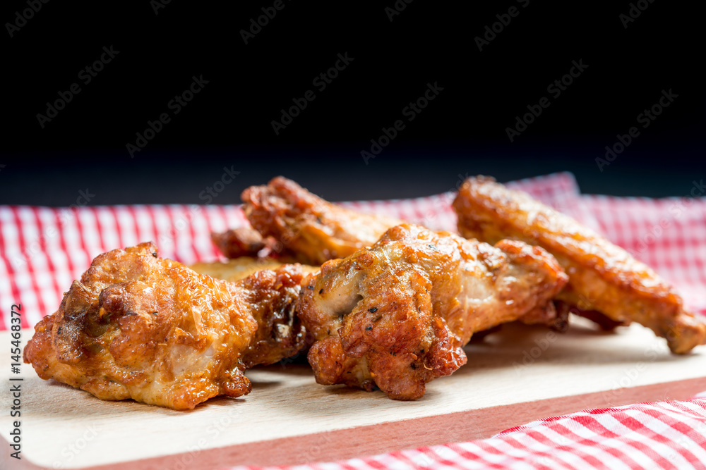delicious fried chicken wings on table