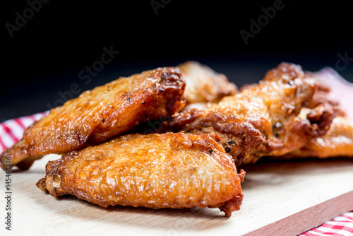 delicious fried chicken wings on table