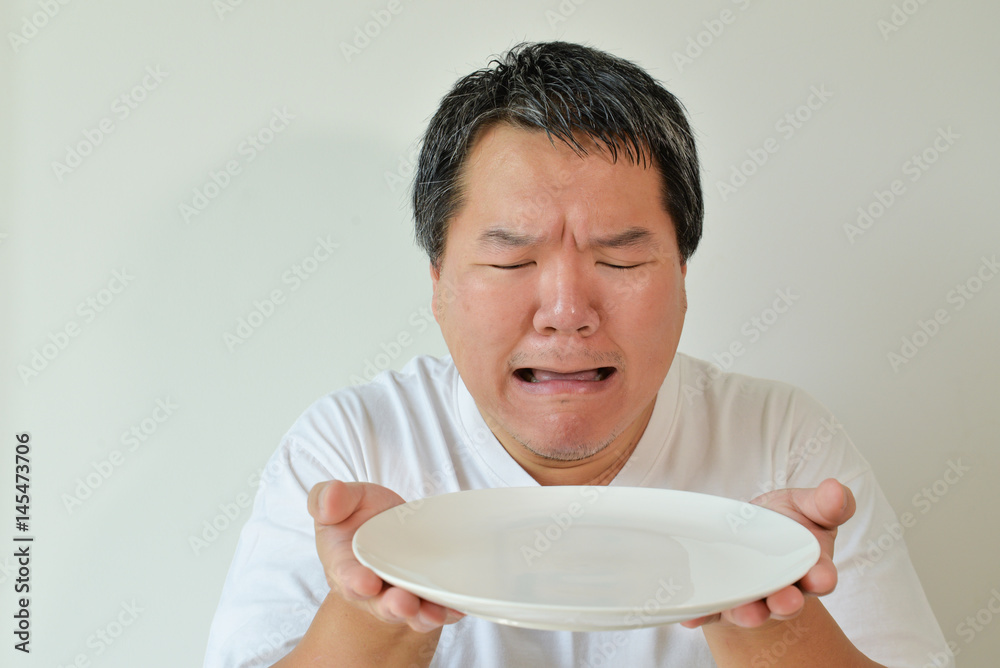 Hungry facial expression - male adult Hungry facial expression - male adult