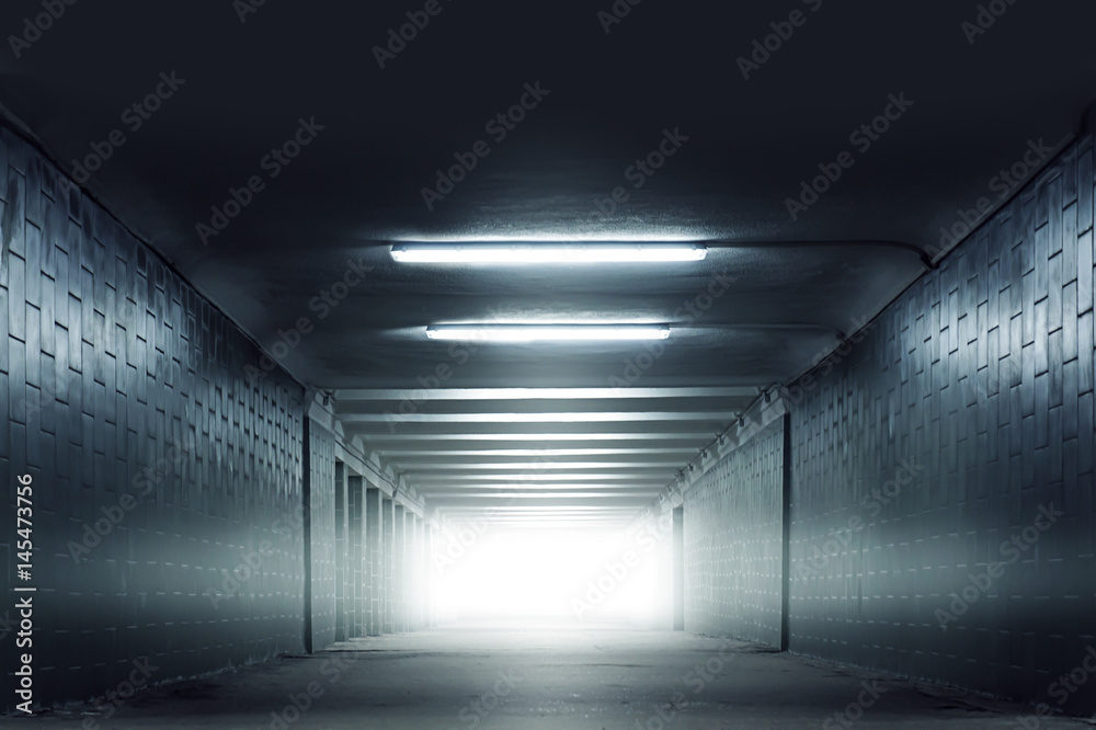 Dark blue urban subway tunnel with light in the end without people photo Dark blue urban subway tunnel with light in the end without people photo