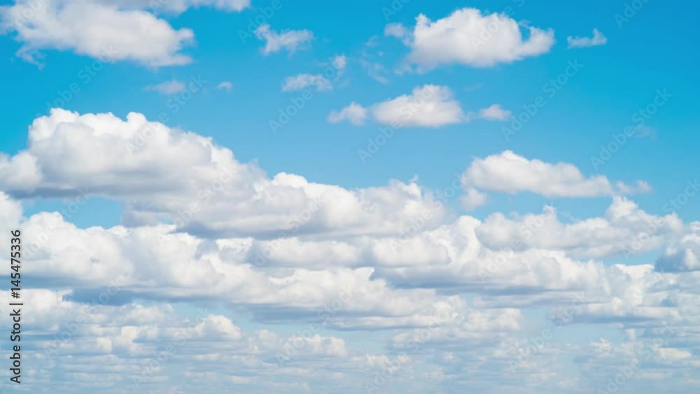 Bright clouds in sunny weather in the sky,Small clouds during the day in sunny weather swim across the sky in an accelerated survey Bright clouds in sunny weather in the sky,Small clouds during the day in sunny weather swim across the sky in an accelerated survey