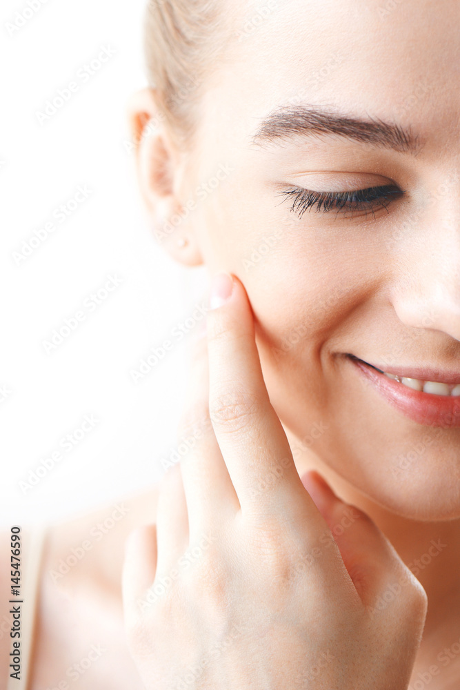 Portrait of girl with makeup hand touching face closeup on white background Portrait of girl with makeup hand touching face closeup on white background