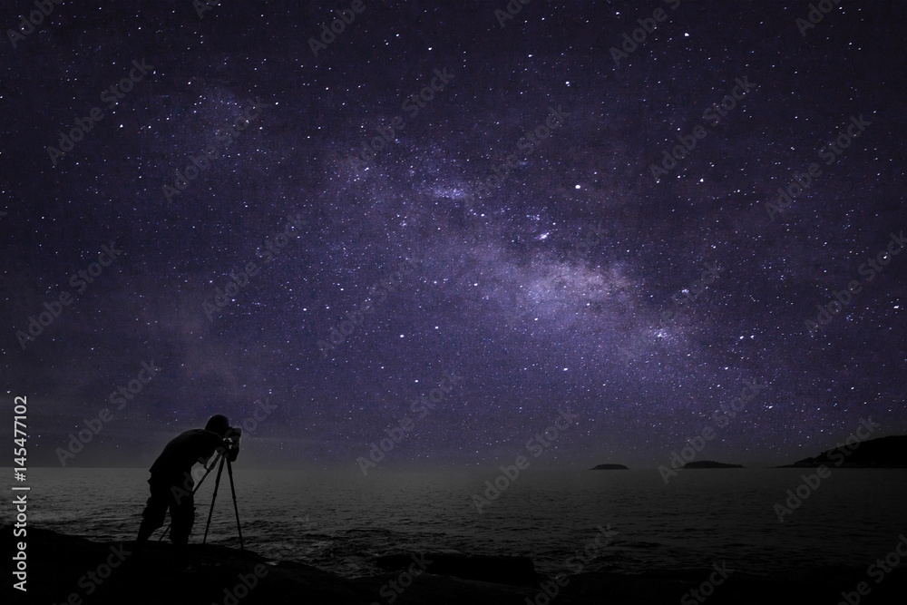Photographer doing photography nightscape with milky way galaxy.