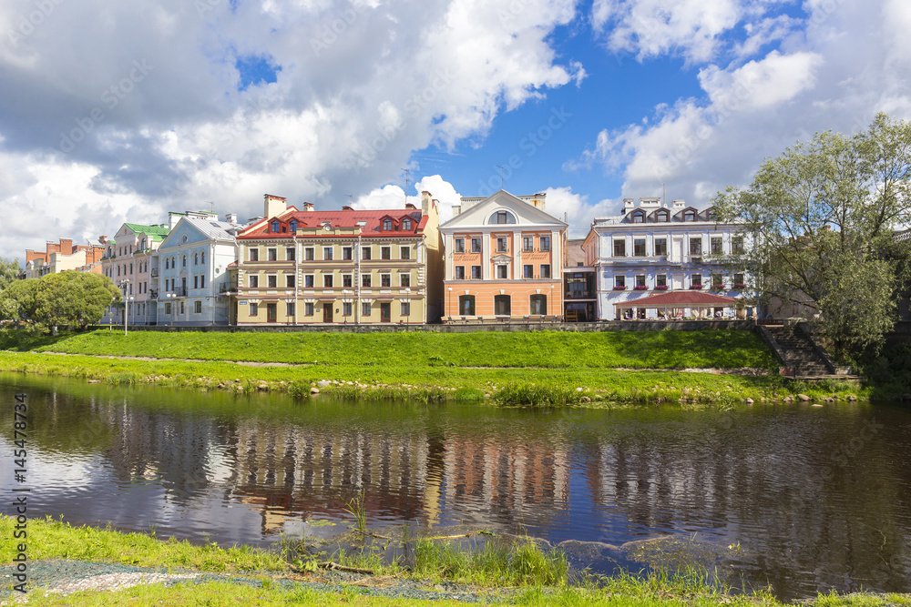 Summer view on town with river and beautiful facades Summer view on town with river and beautiful facades