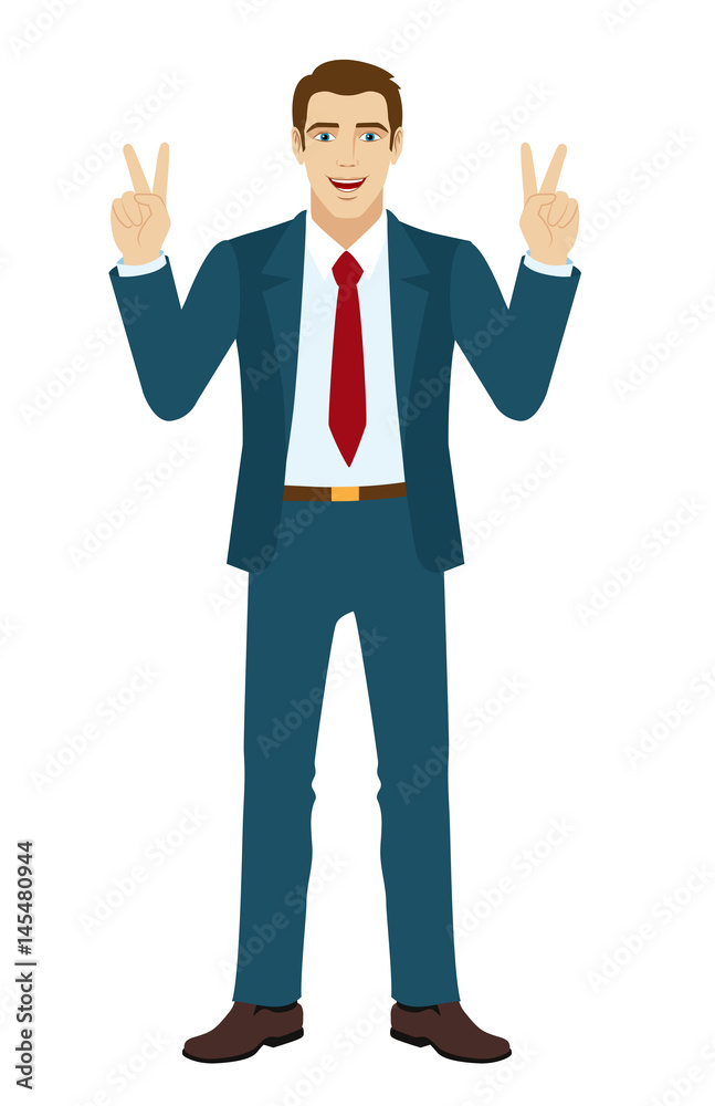 Smiling businessman showing victory sign Smiling businessman showing victory sign