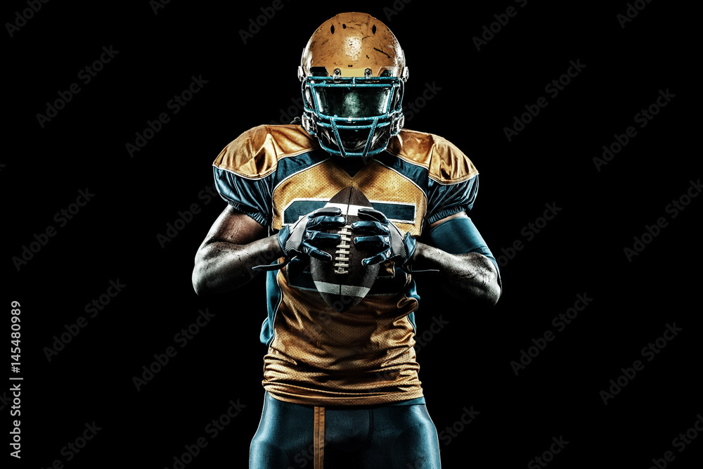 Fototapeta American football sportsman player isolated on black background