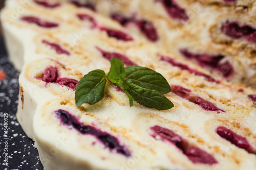 Cake with cream and cherries and cup of coffee,tasty cake with white cream,Russian cake named 