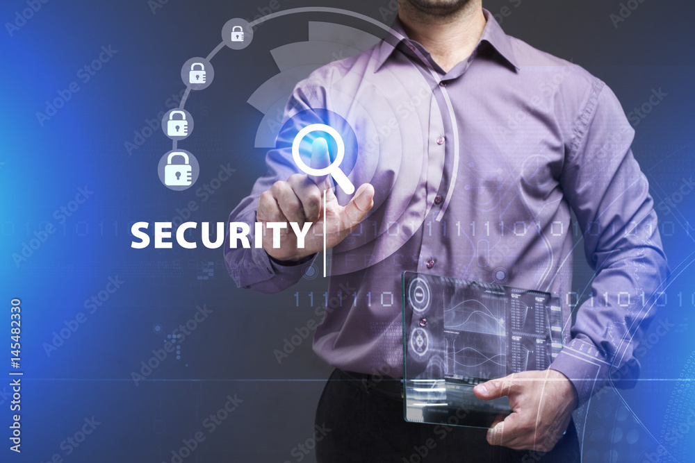 Business, Technology, Internet and network concept. Young businessman working on a virtual screen of the future and sees the inscription: Security Business, Technology, Internet and network concept. Young businessman working on a virtual screen of the future and sees the inscription: Security