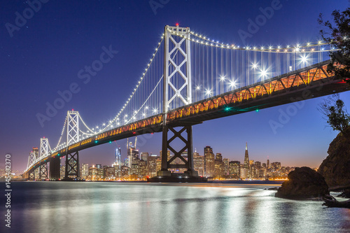 San Francisco skyline with Oakland Bay Bridge at night  California  USA
