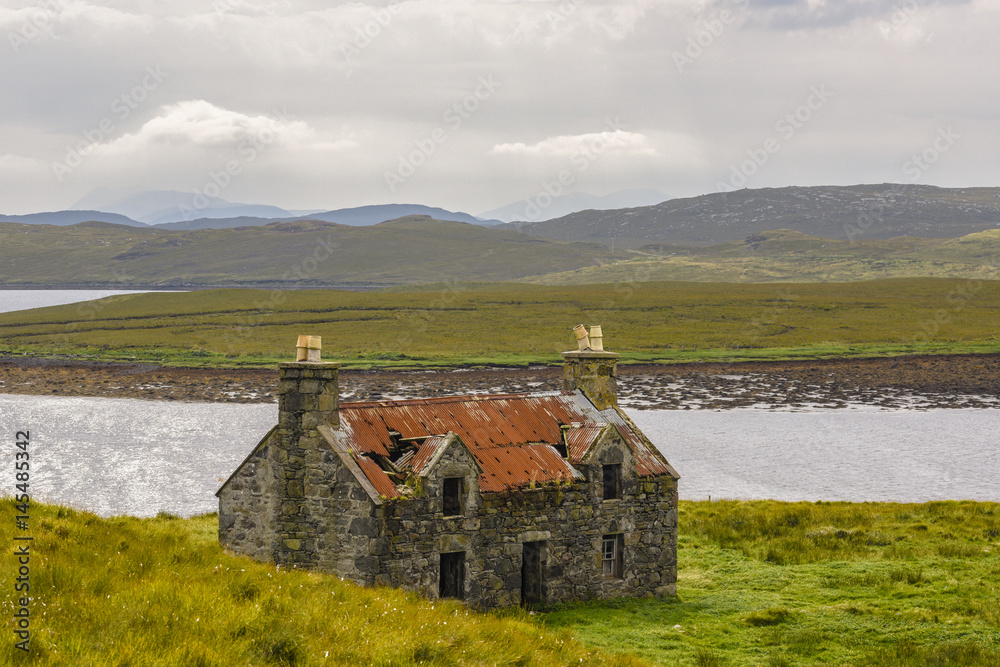 Decayed house in the Scottish Highlands at Callanish stonecircle on Lewis Island, Scotland, Great Britain Decayed house in the Scottish Highlands at Callanish stonecircle on Lewis Island, Scotland, Great Britain