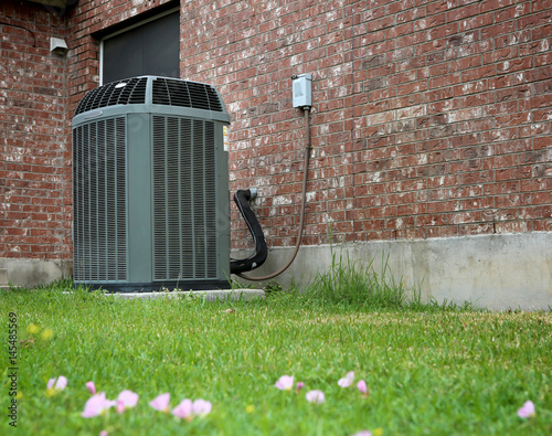 High efficiency modern AC-heater unit on brick wall background