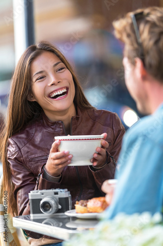 Photography Happy woman drinking coffee at cafe