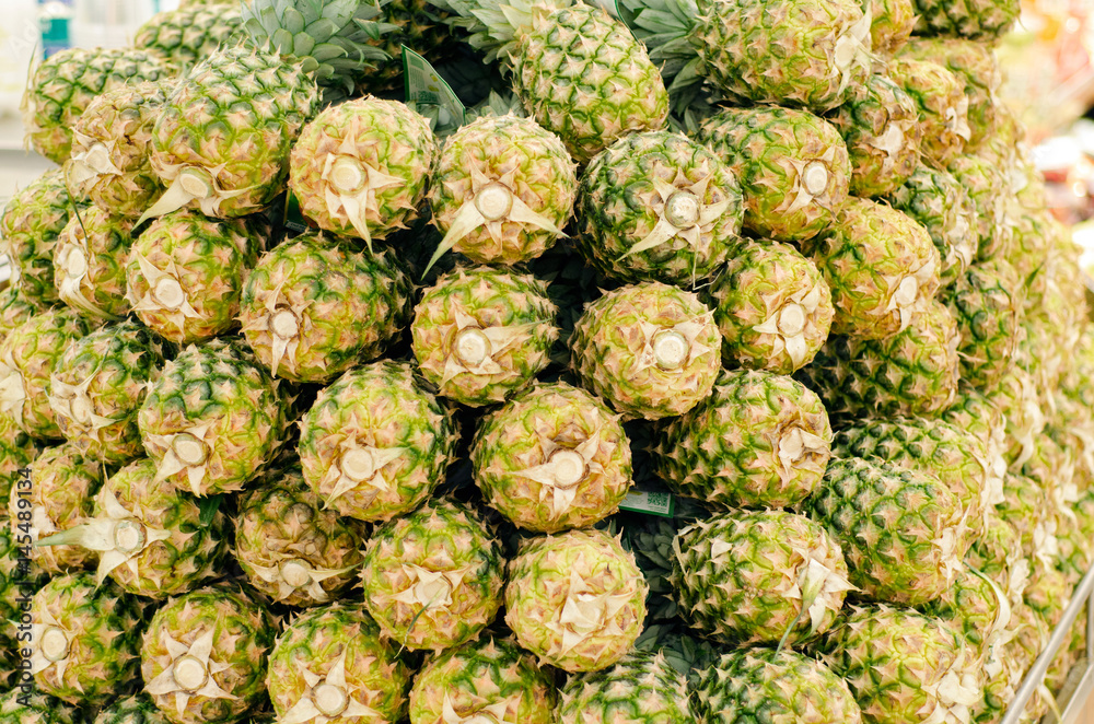 Fototapeta premium Fresh pineapples in supermarket