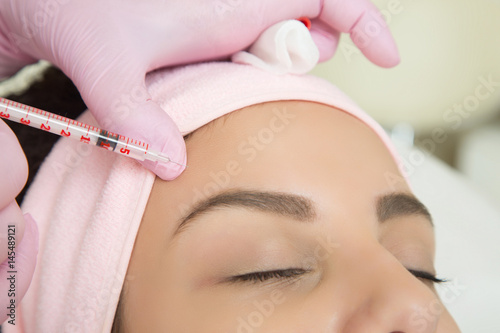 Young woman visiting cosmetologist