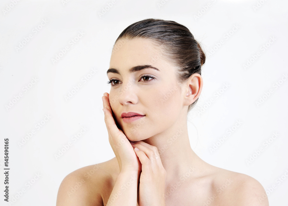 Portrait of beautiful young woman with naked shoulders, on white background. Spa, beauty, health and scincare treatment concept. Portrait of beautiful young woman with naked shoulders, on white background. Spa, beauty, health and scincare treatment concept.