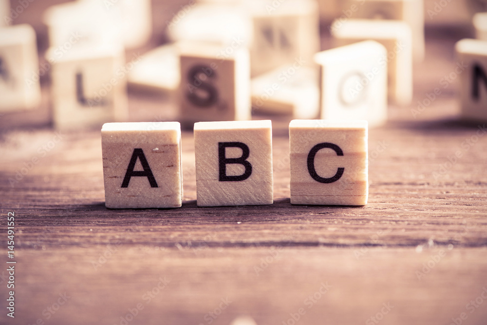 wooden elements with the letters collected in the word abc