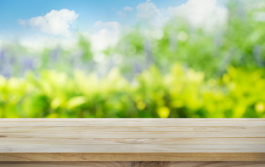 Wood table top on blur tree,garden in morning background .summer,nature concept