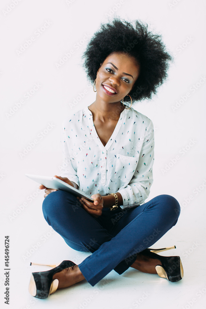 Young african american business woman using the tablet Young african american business woman using the tablet