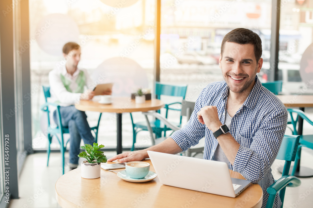 Young stylish man in cafe