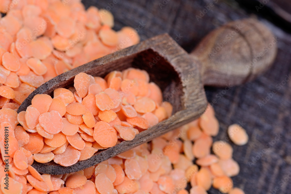 Red lentils in a scoop on table Red lentils in a scoop on table