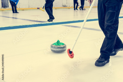 Playing a game of curling.