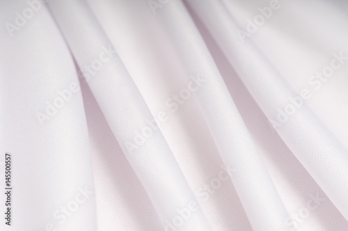 White cloth with pink shade in the folds