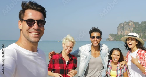 Man Welcome People Group To Take Selfie Photo On Beach On Cell Smart Phone Happy Cheerful Tourists On Vacation Slow Motion 60