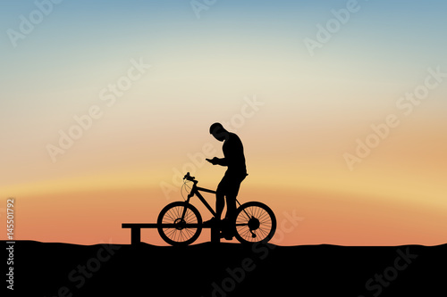 cyclist holding phone