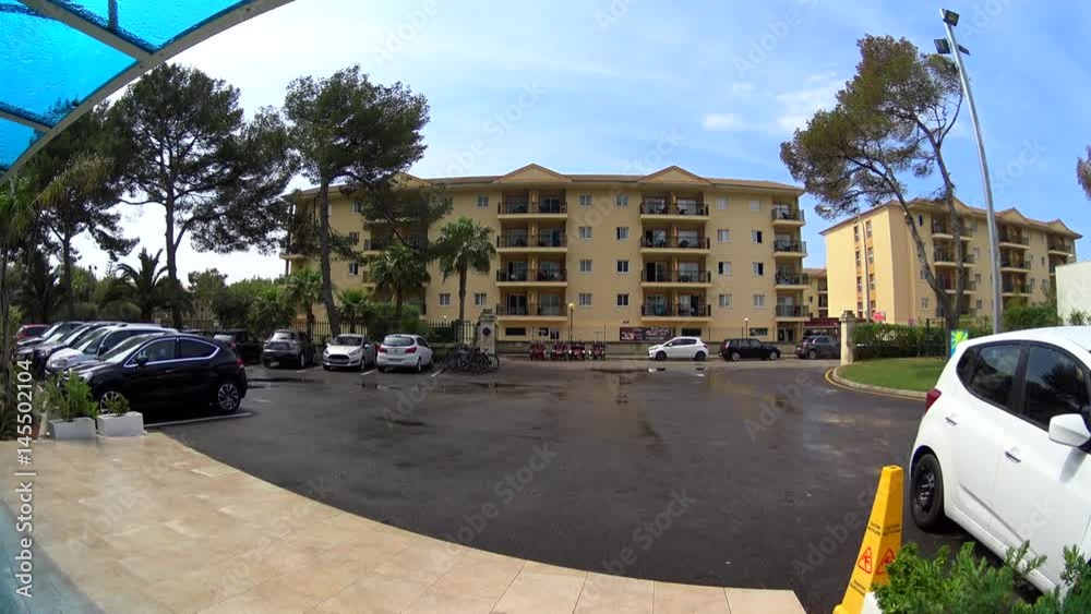 Car parking at the entrance of luxury hotel lobby, sun after rain, Majorca, Spain Car parking at the entrance of luxury hotel lobby, sun after rain, Majorca, Spain