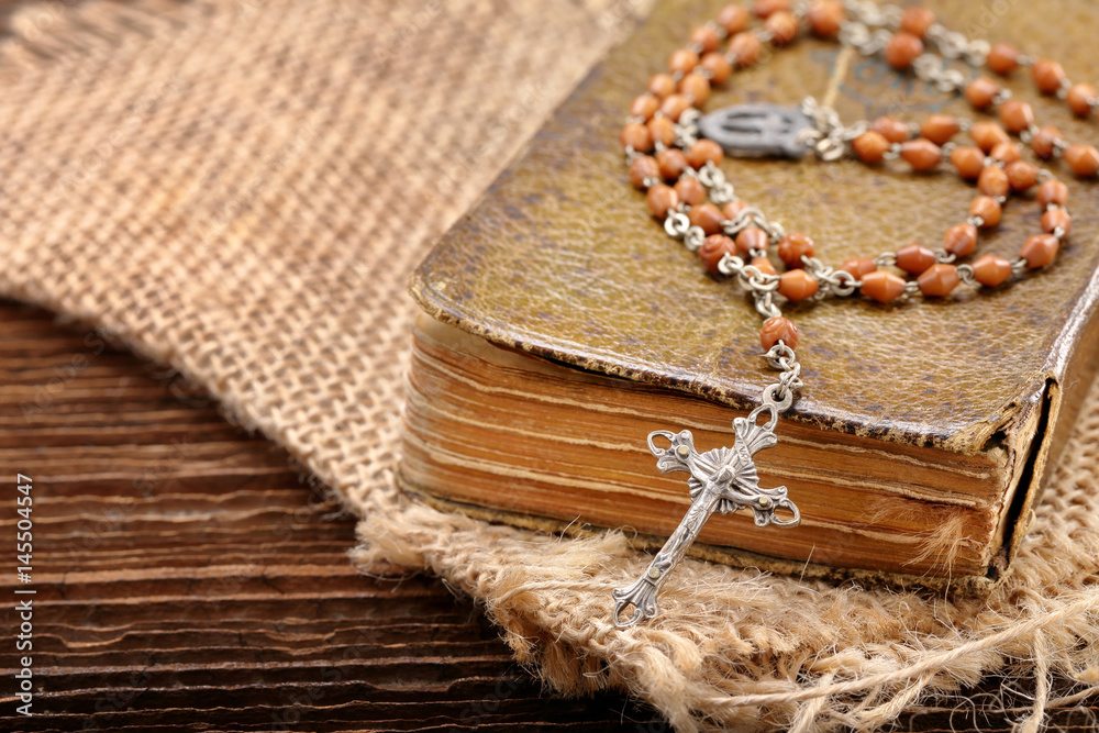 Very old holy bible and metal cross Very old holy bible and metal cross