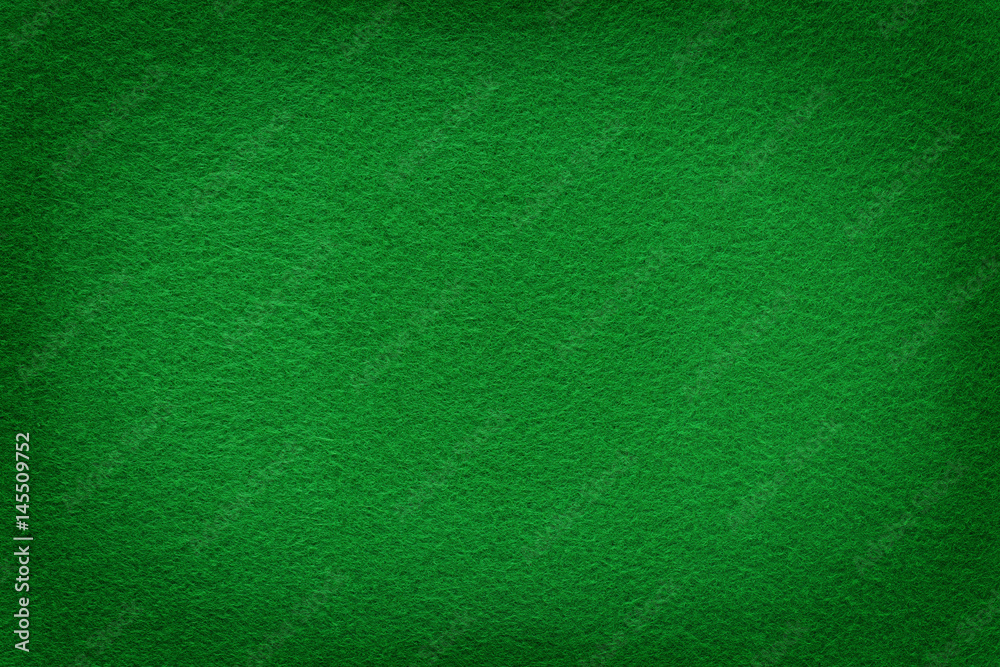 Green felt surface with light copy space in center