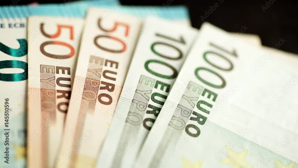 Nobody. Euro banknotes of different values. Euro cash money background. Dolly sliding shot 4K ProRes HQ codec Nobody. Euro banknotes of different values. Euro cash money background. Dolly sliding shot 4K ProRes HQ codec