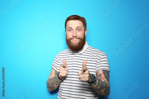 Handsome young man on blue ...
