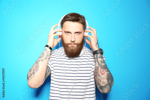 Young bearded man listening...