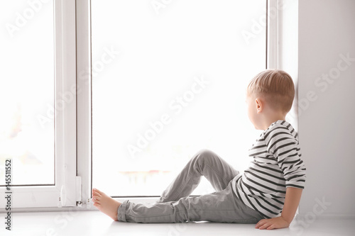 Cute little boy sitting on ...