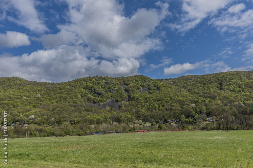Meadows and hills near Kostov village in green valley