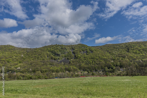 Meadows and hills near Kostov village in green valley