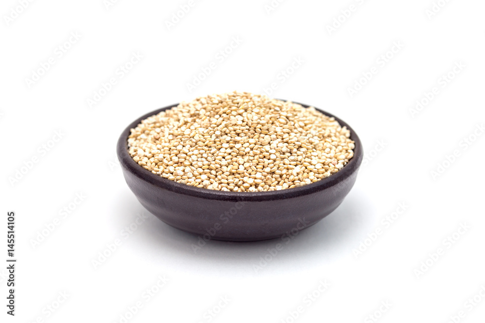Ceramic bowl with healthy quinoa seeds isolated on white Ceramic bowl with healthy quinoa seeds isolated on white