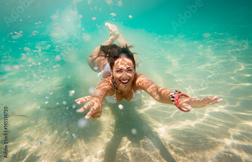 Cute Girl Swimming Under Sea