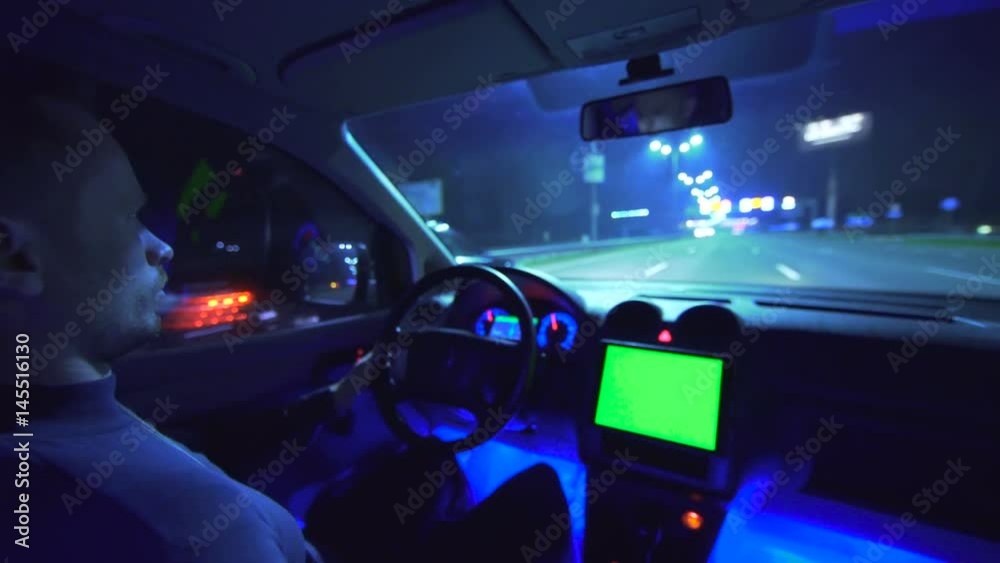 The man drive a vehicle on the night autobahn. inside view. wide angle, alpha channel green screen, real time capture The man drive a vehicle on the night autobahn. inside view. wide angle, alpha channel green screen, real time capture